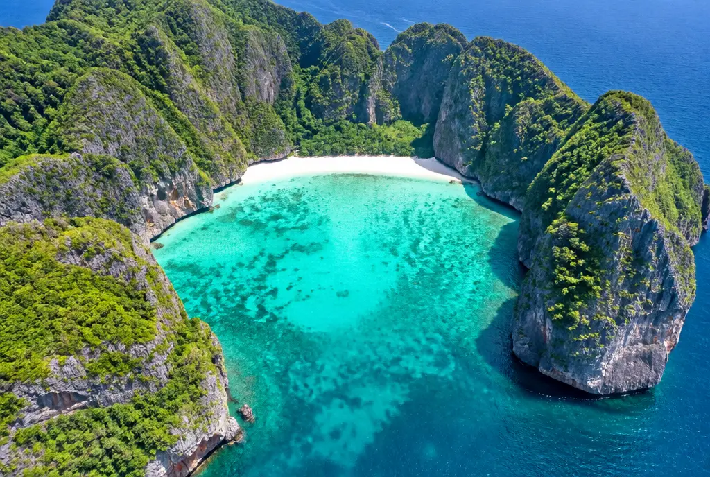 Aerial view of an empty Maya Bay on Koh Phi Phi Leh with turquoise water and limestone walls